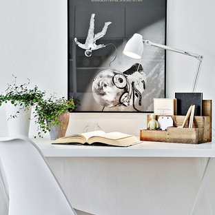 Inspiration for a scandinavian study room in Gothenburg with white walls and a freestanding desk.