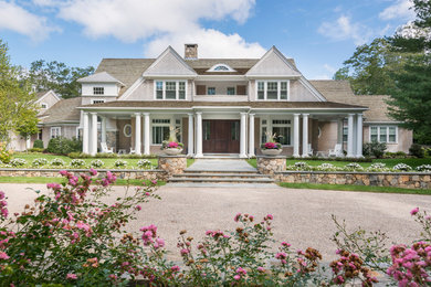 Large elegant beige two-story wood exterior home photo in Boston with a shingle roof