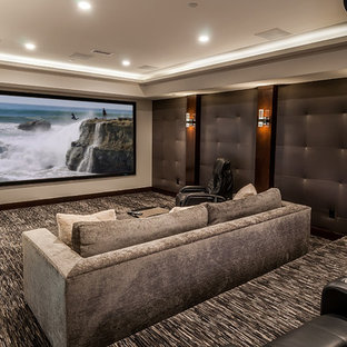 Example of a trendy enclosed carpeted and gray floor home theater design in Los Angeles with gray walls and a projector screen
