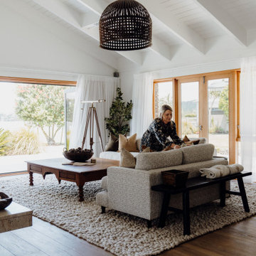 Modern Coastal Living Room with Exposed Beams and Soft Neutrals