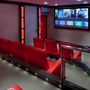 Home theater - contemporary enclosed home theater idea in Boston with a wall-mounted tv