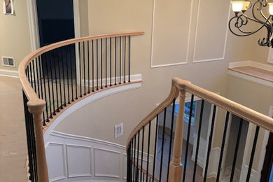 Staircase - large wooden curved mixed material railing staircase idea in Other with wooden risers