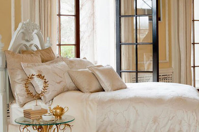 Inspiration for a mid-sized timeless guest light wood floor bedroom remodel in Toronto with yellow walls and no fireplace