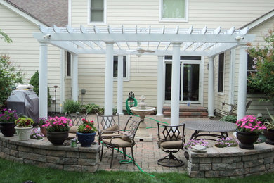 Inspiration for a timeless beige two-story vinyl exterior home remodel in Columbus