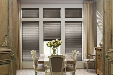 Example of a mid-sized classic light wood floor enclosed dining room design in Indianapolis with gray walls and no fireplace