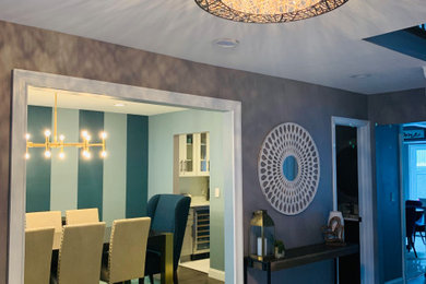 Mid-sized transitional marble floor and white floor hallway photo in New York with gray walls