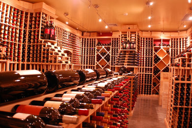 Inspiration for a huge timeless wine cellar remodel in Miami with storage racks