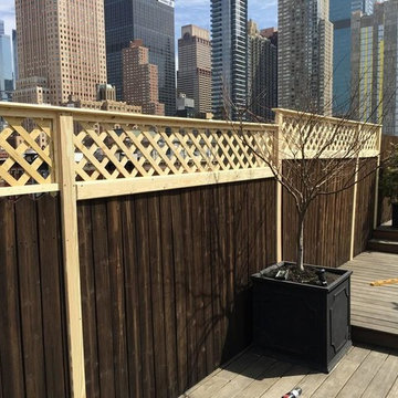 Lattice privacy screen by New York Plantings Garden Designers and Landscape cont