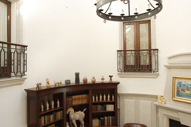 Inspiration for a large mediterranean limestone floor and beige floor foyer remodel in Vancouver with white walls
