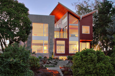 This is an example of a large contemporary three-storey brick exterior in Seattle.
