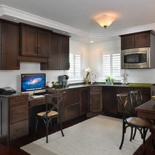This is an example of a small traditional open plan home cinema in Providence with white walls and dark hardwood flooring.