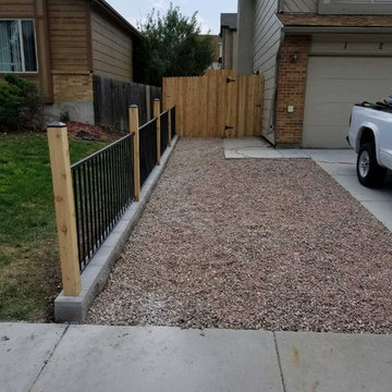Cedar fence and wrought iron fence