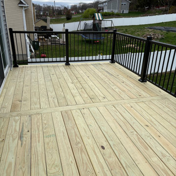 Pressure Treated Wood Deck with black powder coated rail