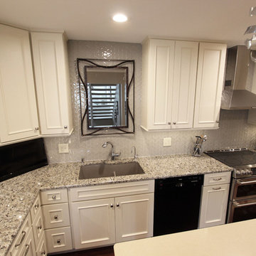Medallion Painted White Chocolate Kitchen Cabinets with Petal Mosaic Backsplash