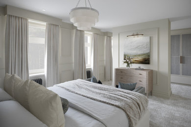 Design ideas for a large contemporary master bedroom in Other with beige walls, carpet, grey floors and a dado rail.