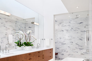 Inspiration for a contemporary bathroom in Austin with an undermount sink, flat-panel cabinets, dark wood cabinets, a freestanding tub, white tile, white walls and mosaic tile floors.