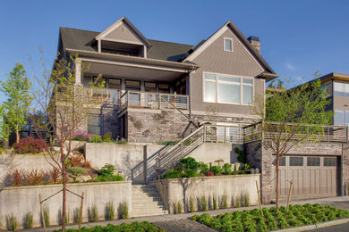 Example of a transitional gray exterior home design in Seattle