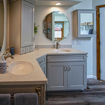Waypoint Gray Shaker Door Cabinetry with Tiled Shower and Matching Tub Surround
