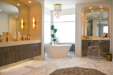Design ideas for an expansive modern master bathroom in San Diego with flat-panel cabinets, grey cabinets, a freestanding tub, a corner shower, a one-piece toilet, beige walls, marble floors, an undermount sink, quartzite benchtops, grey floor, a hinged shower door and white benchtops.