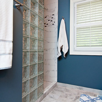 Lodge Look Makeover with Master Bedroom and Garage Addition in Wooded Setting