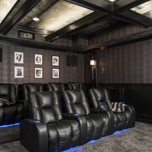 Large traditional enclosed home cinema in St Louis with grey walls, carpet and a projector screen.