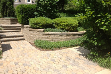 This is an example of a large shade side yard stone driveway in Other.