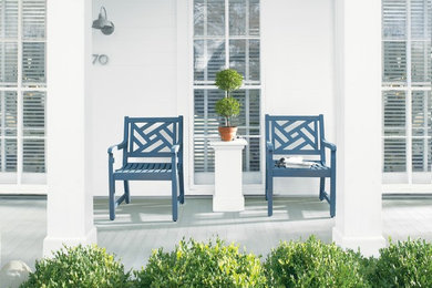 This is an example of a mid-sized contemporary front yard verandah in Other with decking and a roof extension.