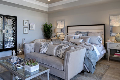 Large transitional master light wood floor and gray floor bedroom photo in Orange County with gray walls and no fireplace