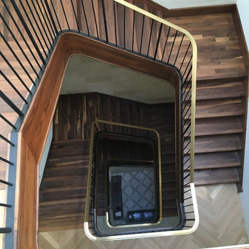 Walnut Stairs with Bronze Handrail and Iron Balusters