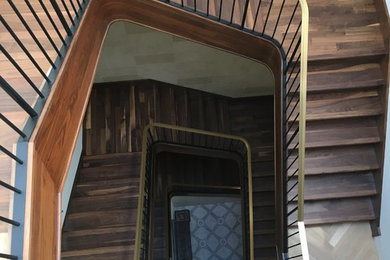 Walnut Stairs with Bronze Handrail and Iron Balusters