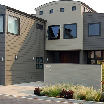 Materials and architectural forms describe living areas in the house.