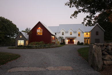 Large cottage multicolored three-story metal gable roof idea in New York