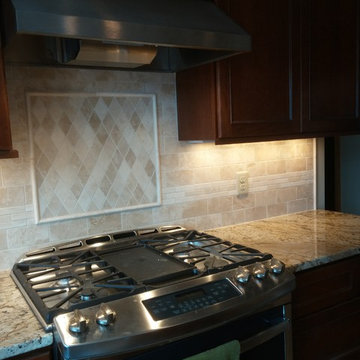 Travertine Kitchen Backsplash with Picture Frame Deco