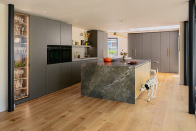 This is an example of a contemporary kitchen in Sussex.