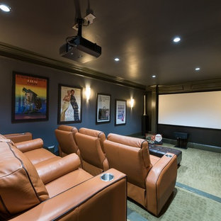 Design ideas for a traditional enclosed home cinema in Atlanta with grey walls, a projector screen and green floors.