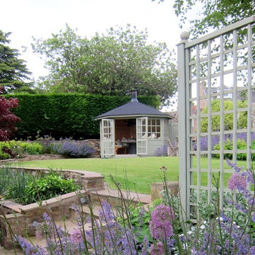 New steps, terracing, retaining walls, planting and the BBQ house
