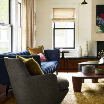 Eclectic Living Room with Velvet Sofas, Animal Print Rug, and Herringbone Firepl