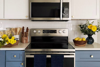 Mid-sized transitional l-shaped porcelain tile and white floor enclosed kitchen photo in Wilmington with a single-bowl sink, shaker cabinets, blue cabinets, quartzite countertops, white backsplash, subway tile backsplash, stainless steel appliances, no island and white countertops