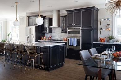 Eat-in kitchen - transitional light wood floor eat-in kitchen idea in Other with raised-panel cabinets, gray backsplash, stainless steel appliances, an island, granite countertops and marble backsplash