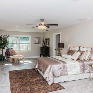 Luxorious master bedroom with seating.