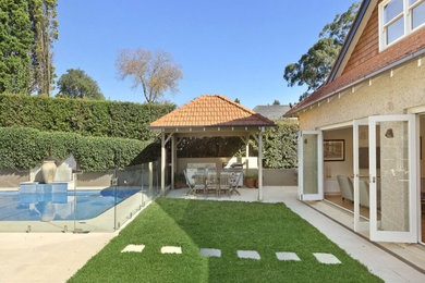 This is an example of a mid-sized traditional patio in Sydney.
