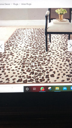 An Inexpensive Area Rug With A Chocolate Brown Couch