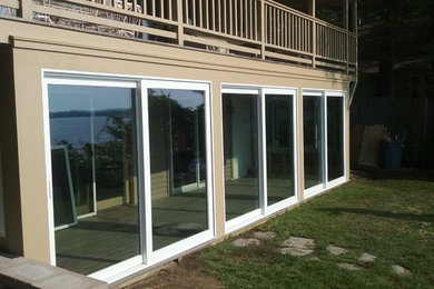 Mid-sized arts and crafts gray floor sunroom photo in Portland Maine with a standard ceiling
