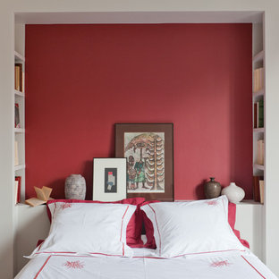Small tropical guest bedroom in Paris with red walls.