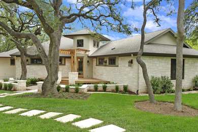 Example of a large trendy home design design in Austin
