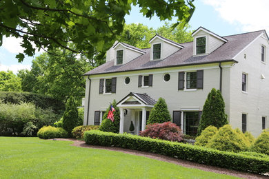 Large traditional white three-story brick house exterior idea in Nashville with a shingle roof