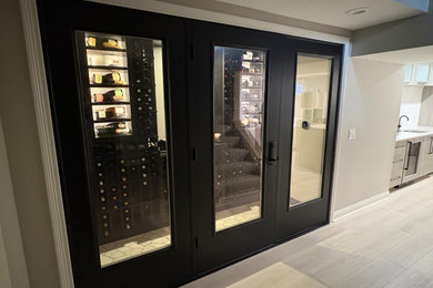 Inspiration for a small modern ceramic tile wine cellar remodel in Cincinnati