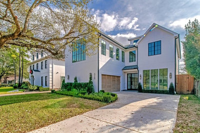 Large transitional white three-story stucco exterior home idea in Houston with a shingle roof