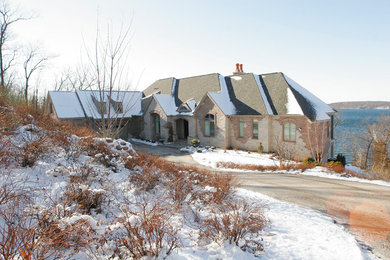 Example of a mountain style two-story mixed siding exterior home design in Other
