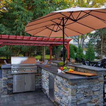 Make a Statement with a Versatile Outdoor Kitchen and Double Fire Feature